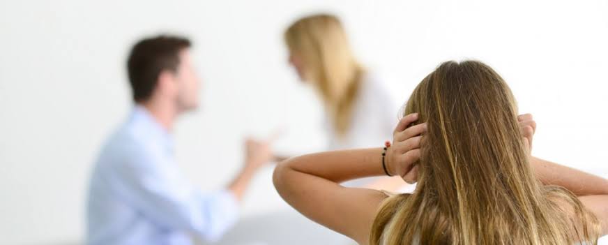 Child covering ears while parents argue – parenting orders lawyer Adelaide, East End Legal